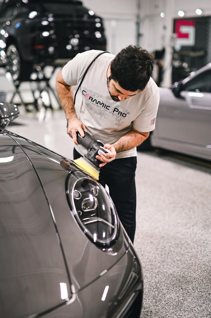 A Man Polishing a Car